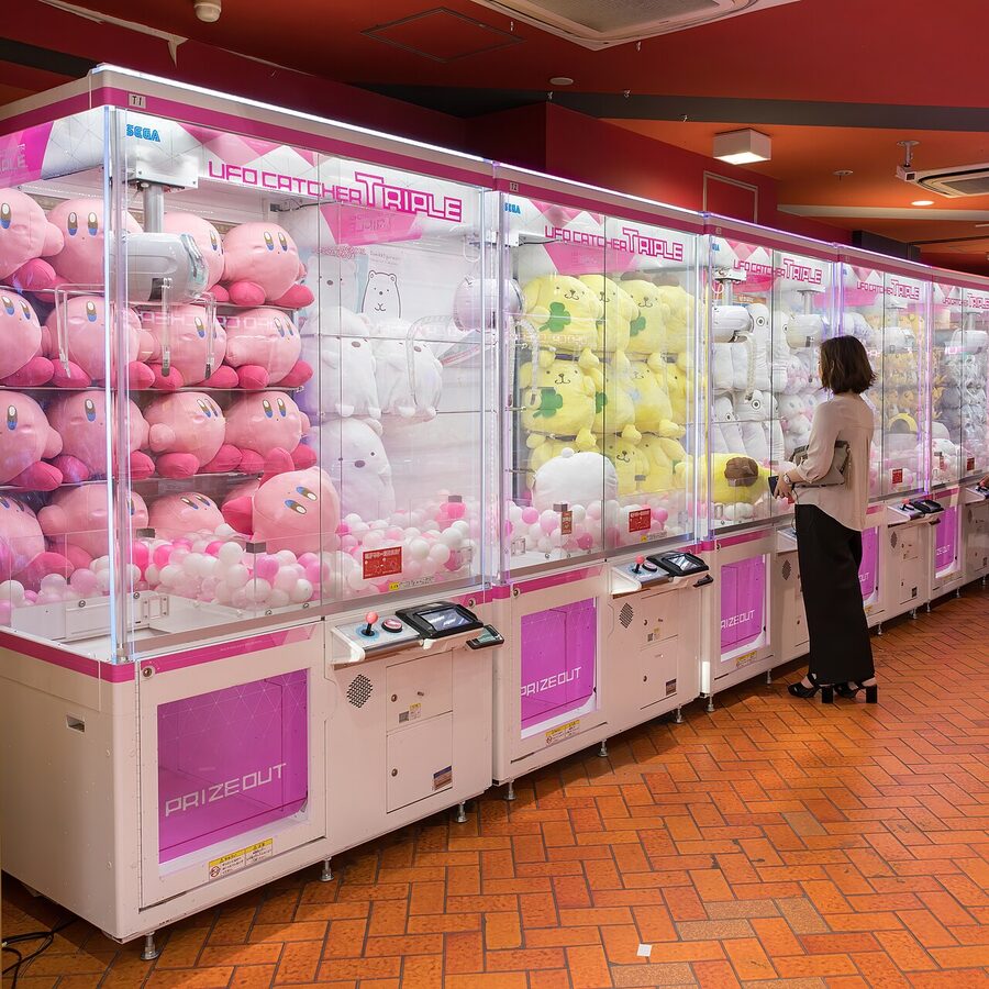 Claw machines with kawaii stuffed mascots in Akihabara arcade