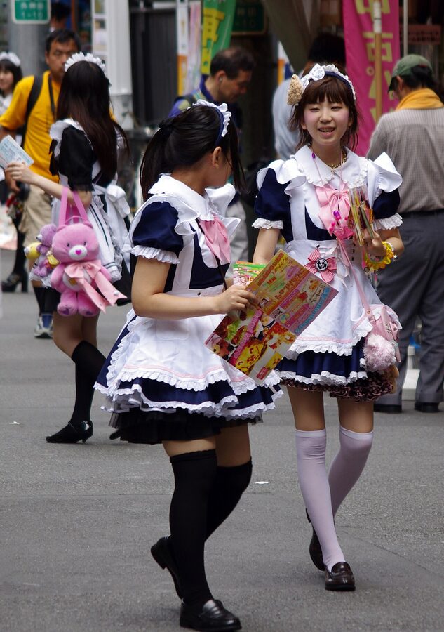 Maid cafe touts distributing flyers on Akihabara street