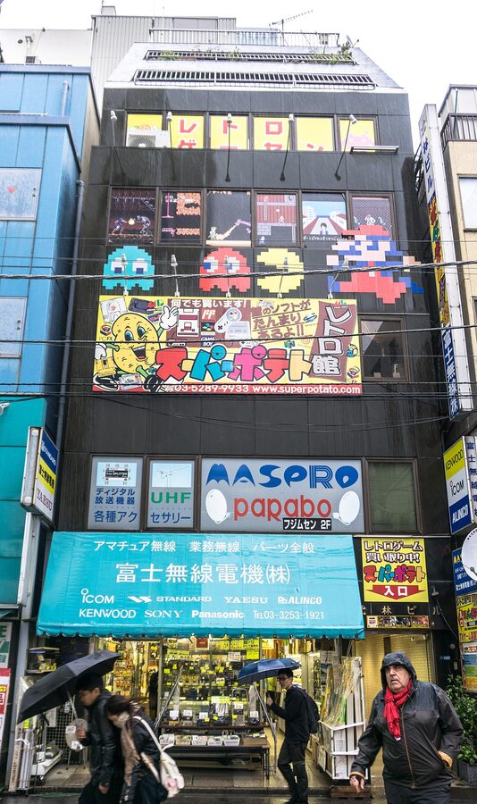 Super Potato retro game shop interior Akihabara with old consoles and cartridges