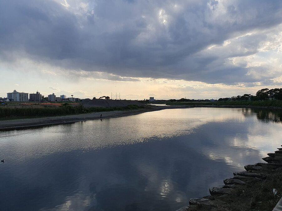 The Tamagawa riverbank walking path on a clear day