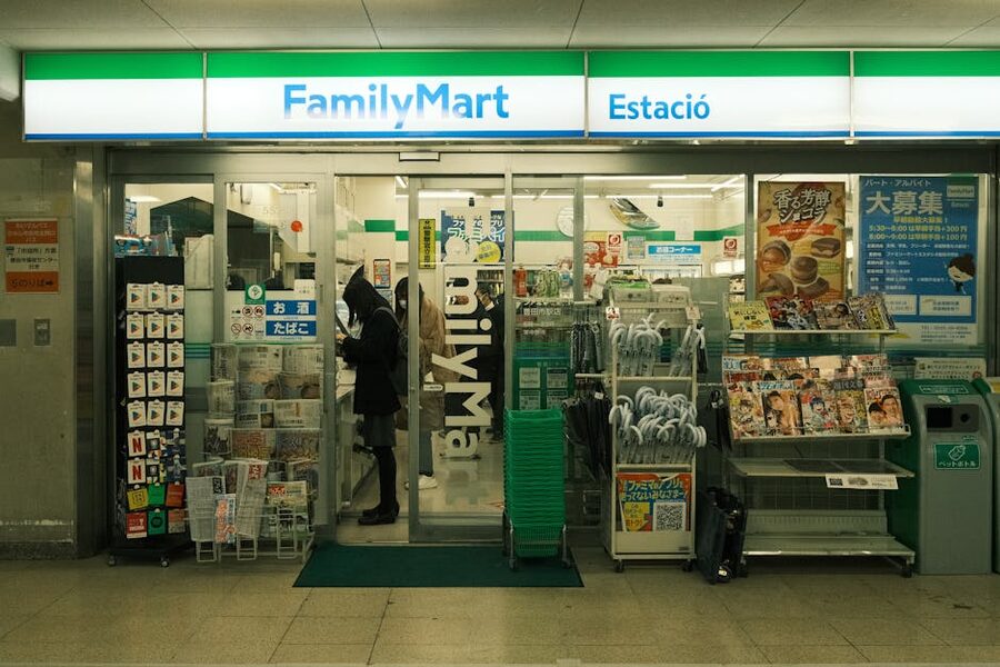 FamilyMart entrance with merchandise and people in Japan