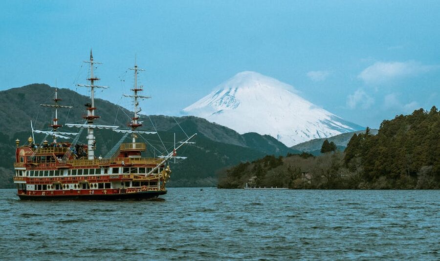 Bright red pirate-themed sightseeing ship on Lake Ashi with Mt Fuji in the background