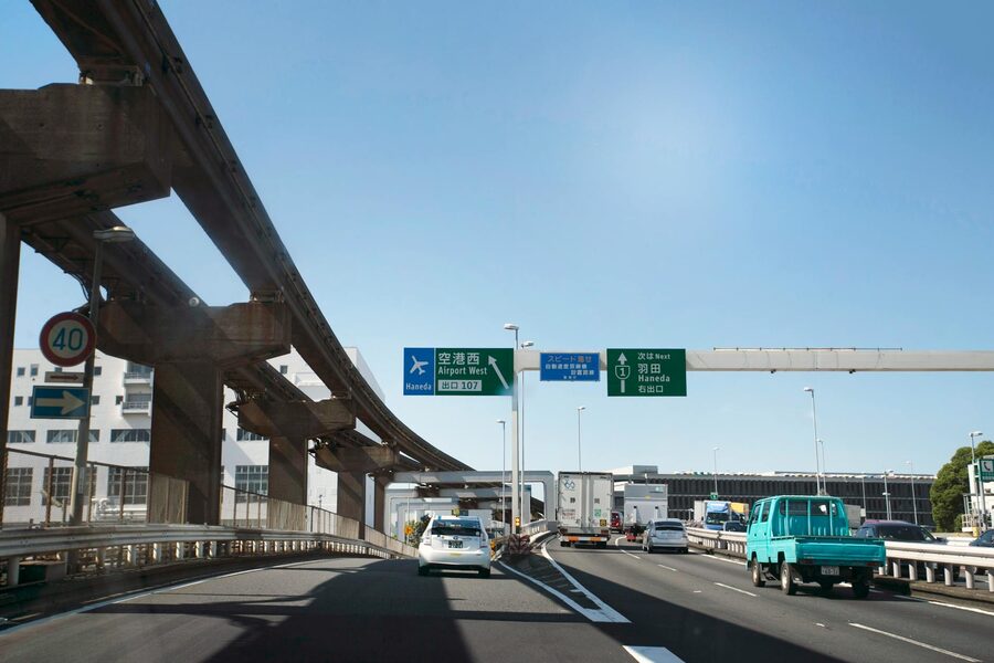 Highway road with Haneda Airport signs