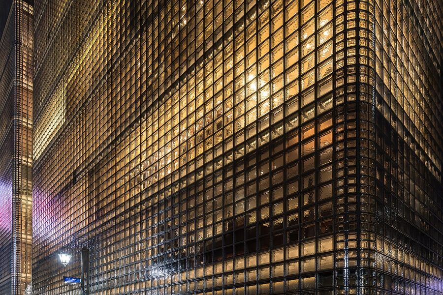 Illuminated Maison Hermes glass block facade in Ginza at night