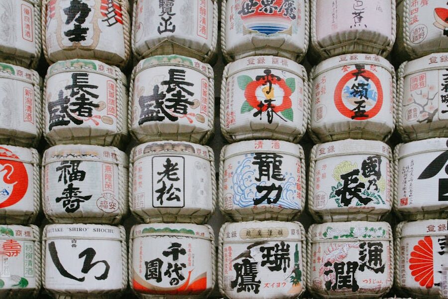 Traditional Japanese sake barrels with calligraphy display