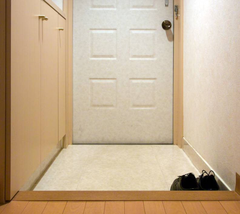 A Japanese genkan entryway with a step up into the house