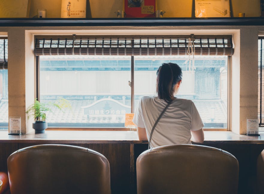 Cafe window in Kawagoe looking onto historic street with kura architecture