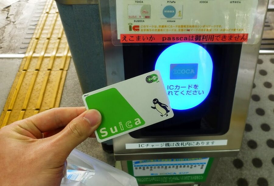 Suica card being tapped on a Japanese card reader
