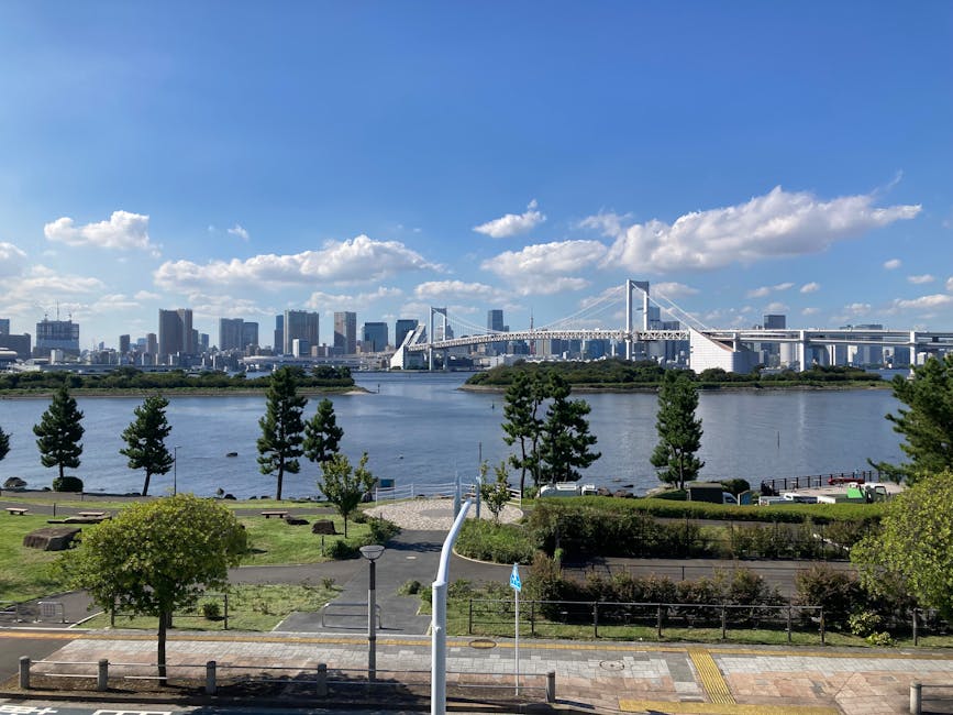 Rainbow Bridge spanning Tokyo Bay with Odaiba skyline on a clear day