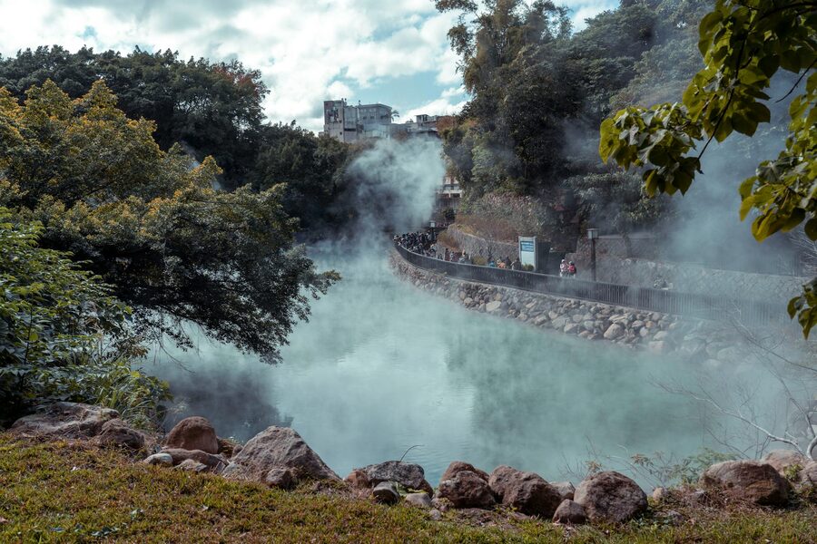 Japanese hot spring with steam rising from mineral water in nature