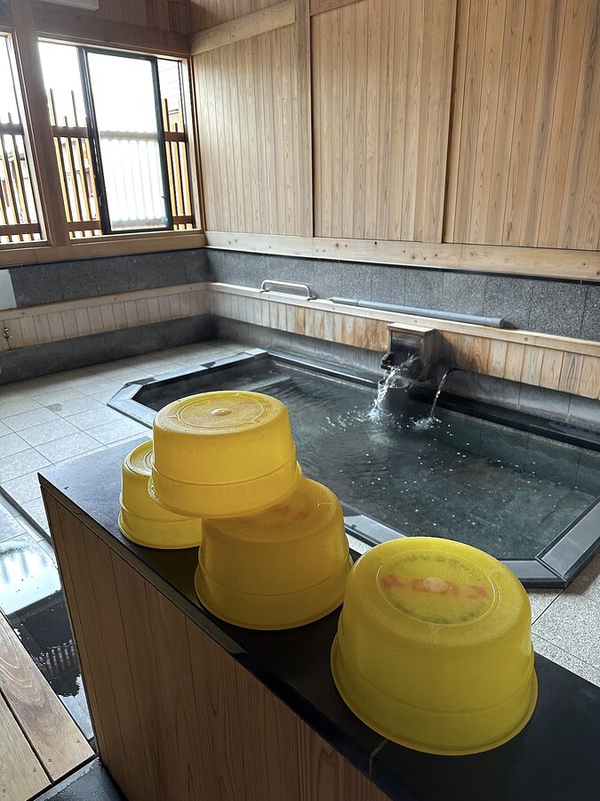 Wooden interior of a traditional public bathhouse at Nozawa Onsen