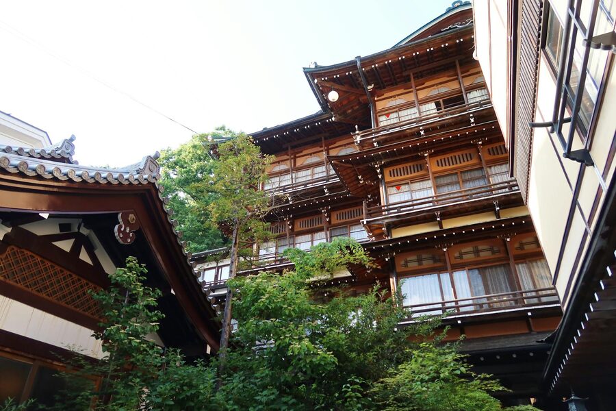 Dark wooden exterior of a traditional ryokan in Yamanouchi Nagano