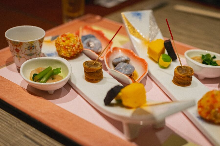 A Japanese kaiseki meal with small dishes arranged on a tray