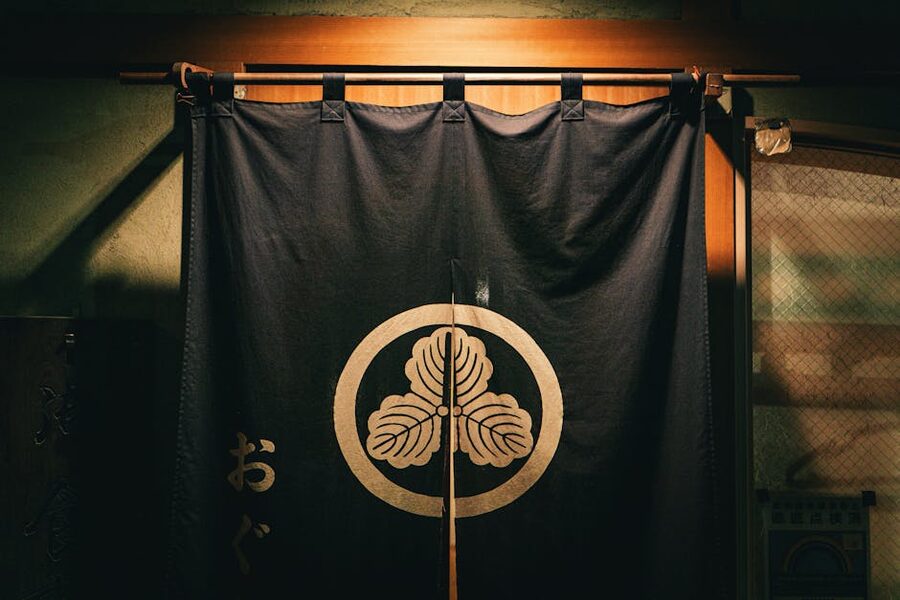 A traditional Japanese noren curtain at a restaurant entrance