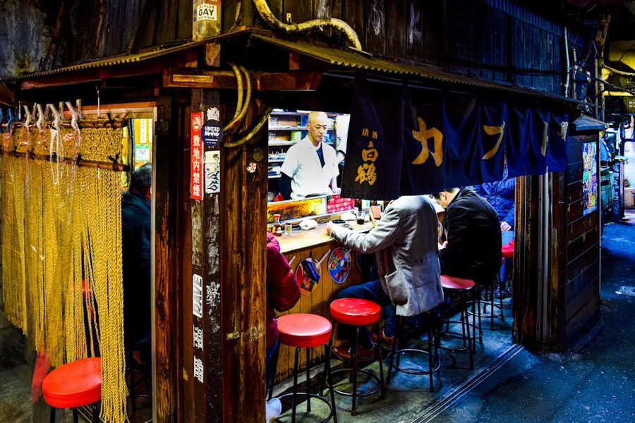 Diners eating at Omoide Yokocho alley in Shinjuku, Tokyo