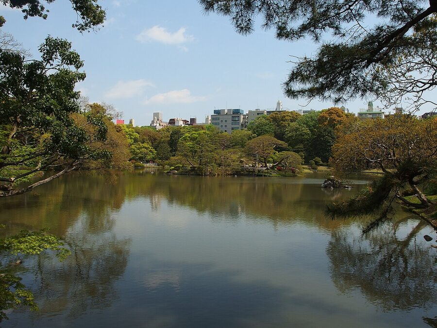 Spring azaleas flowering along the pond edge at Rikugien Garden, Tokyo