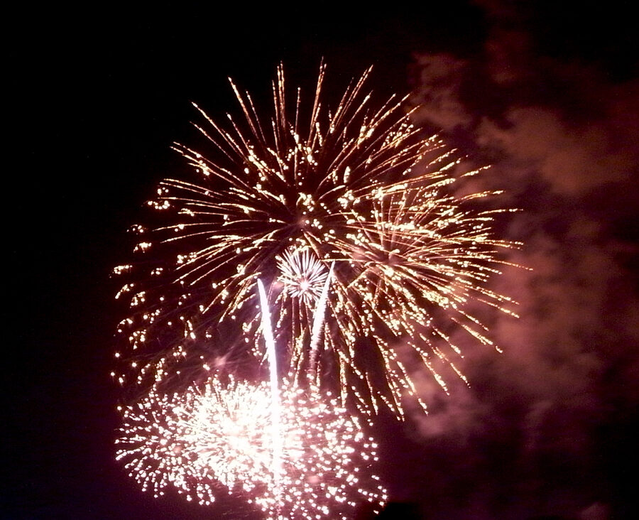 Tamagawa fireworks reflected in the Tama River at night during the 2009 festival