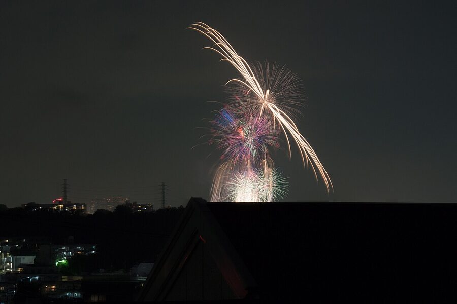 Tamagawa fireworks seen from a distance along the river