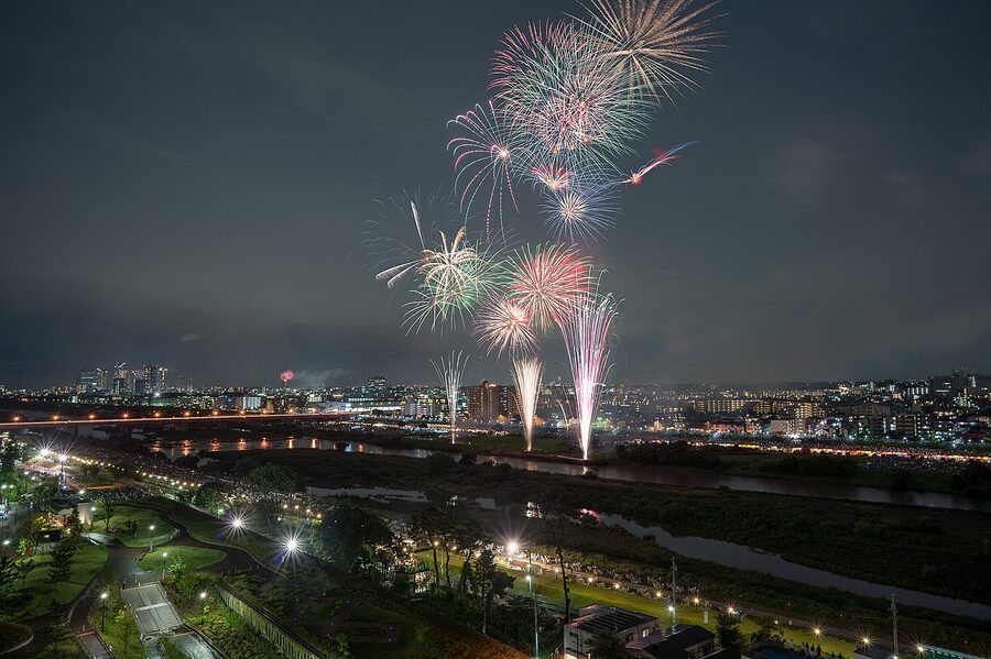 Tamagawa fireworks shells opening in flower patterns