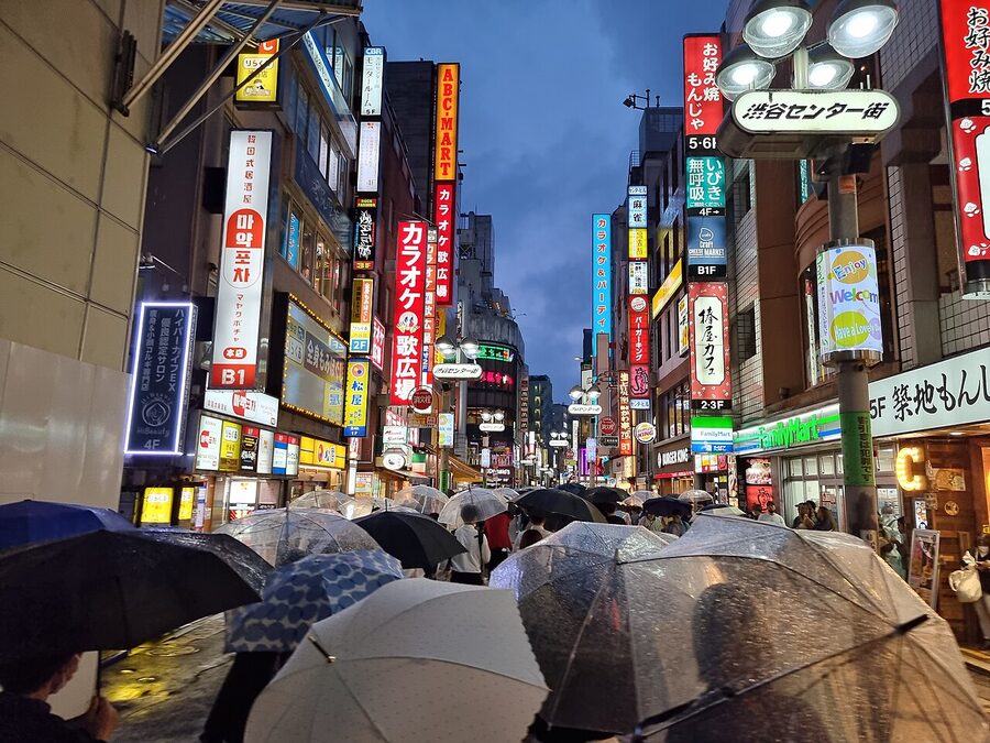 Shibuya Center Gai pedestrianised street packed with people and signs, Tokyo