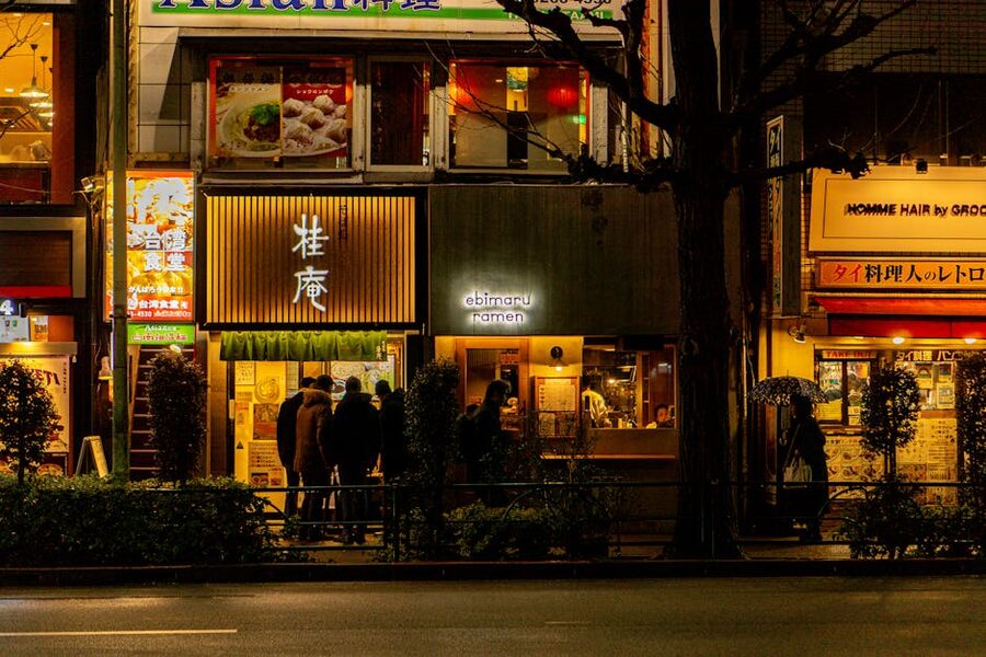 Tokyo ramen shops at night near Shinjuku Station