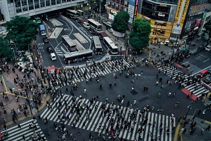 Aerial view of Shibuya Crossing with pedestrians crossing in multiple directions