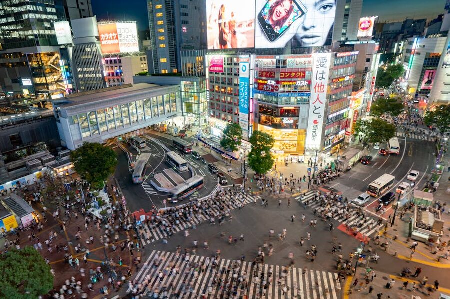 Crowds at Shibuya Crossing illuminated at night