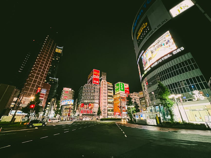 Shinjuku streets at night with bright neon signage