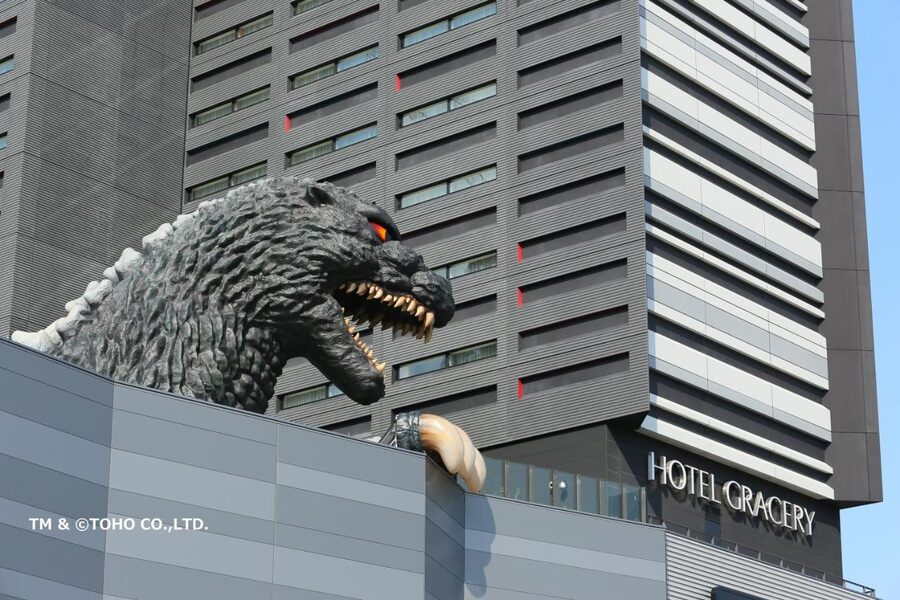 Hotel Gracery Shinjuku tower with Godzilla head visible above the cinema podium