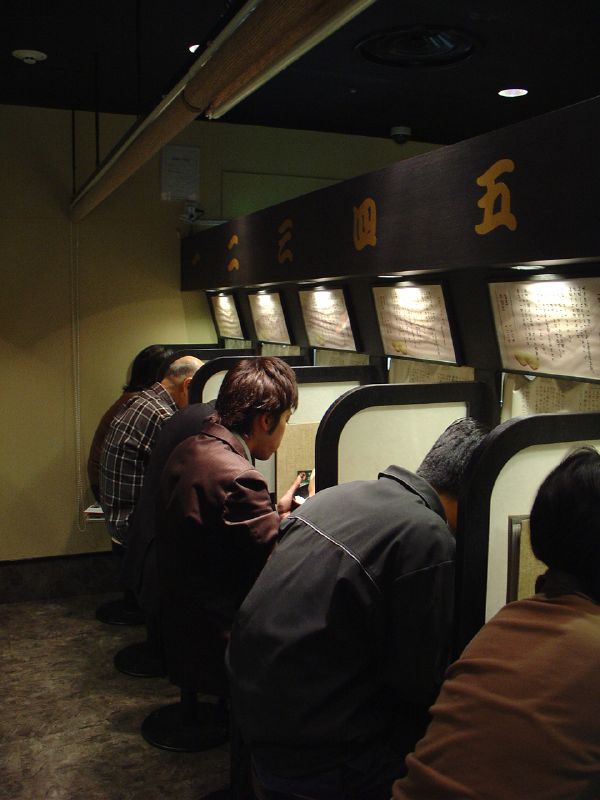 Counter seating inside a traditional Japanese ramen shop