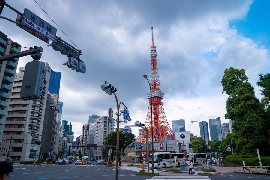 Tokyo Tower seen from the Akabanebashi Bridge crossing with traffic signals