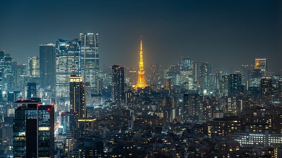 Tokyo Tower illuminated in orange Landmark Light with the Minato City skyline at night