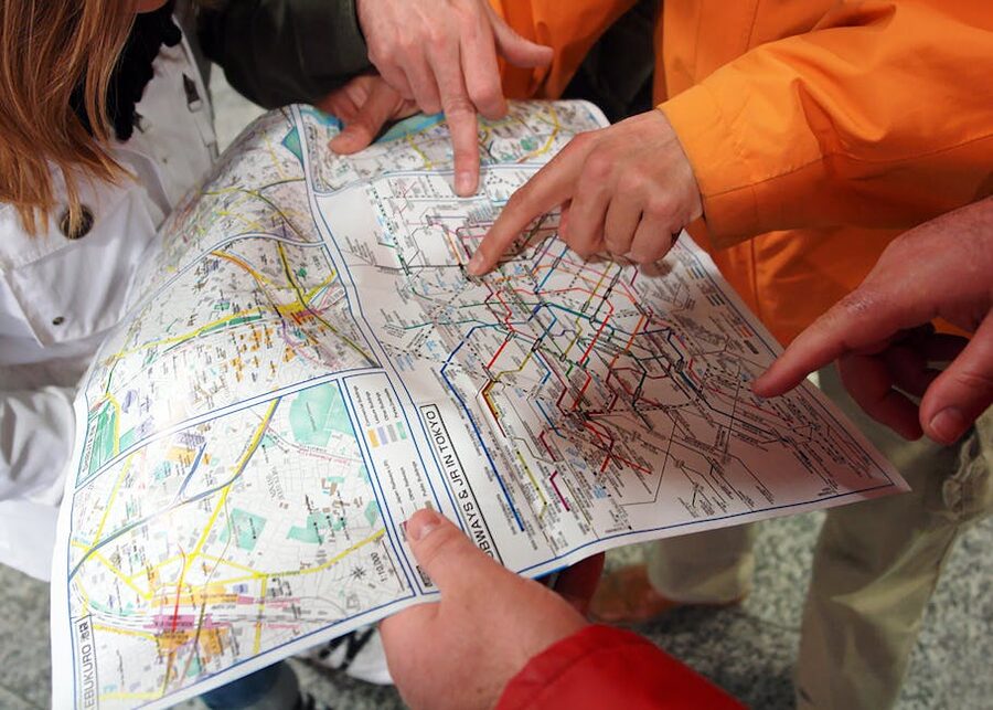 Travellers studying a Tokyo subway map together