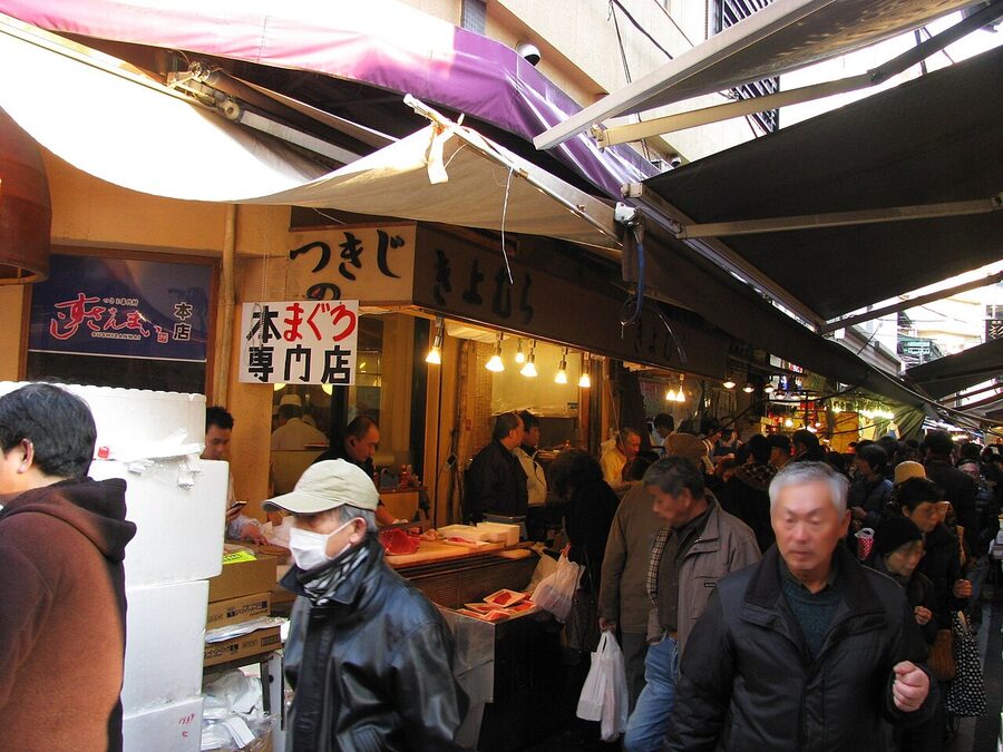 Storefront display at Tsukiji Outer Market with hanging produce