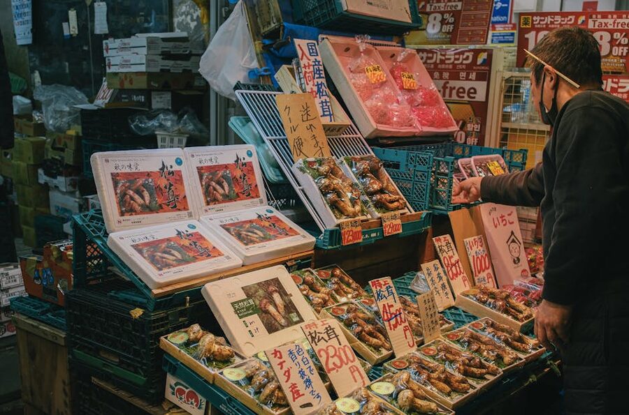 Seafood display with ice-packed fish at a Japanese market vendor stall