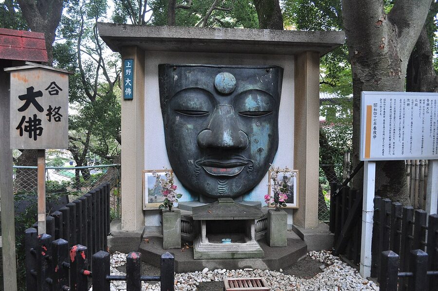 The bronze face of the Great Buddha of Ueno, the only remaining fragment of the original statue, mounted on a small shrine in Ueno Park