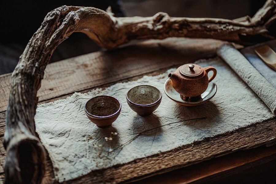 Japanese tea ceremony set with a kettle and pottery cups