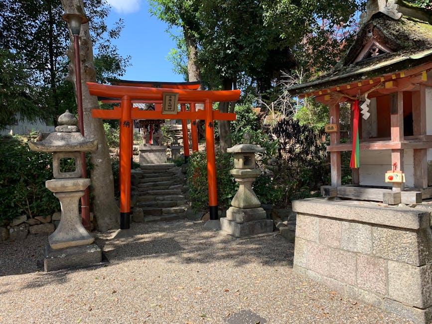 A traditional red torii shrine gate at a Japanese shrine