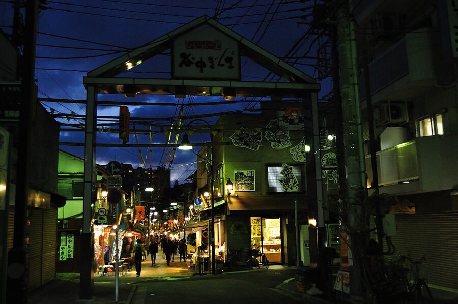 Yanaka street at twilight with shop lanterns