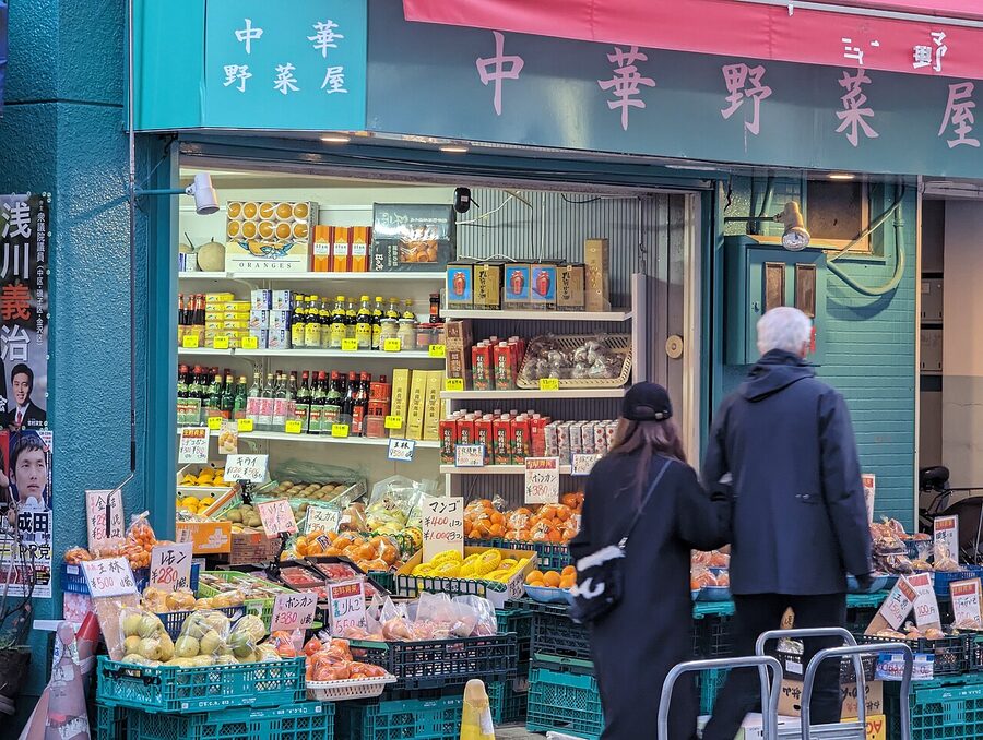 A street in Yokohama Chinatown lined with red-fronted restaurants