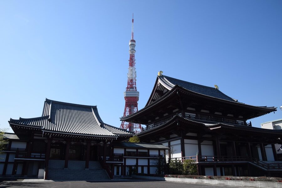 Zojoji Temple gate with Tokyo Tower rising behind it on a clear day