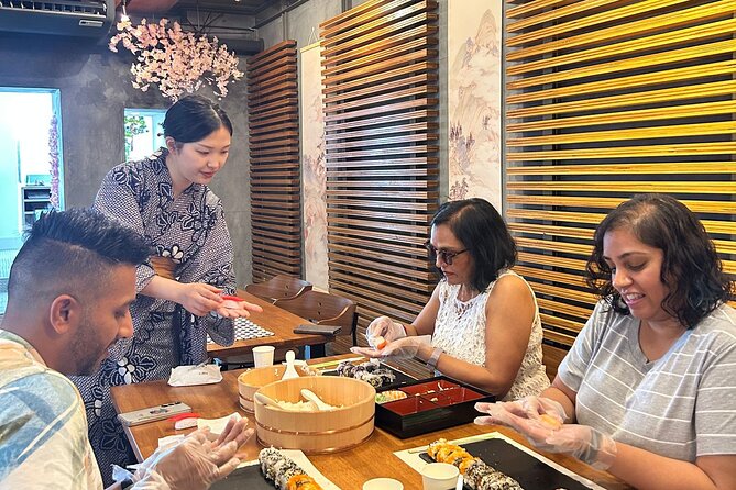 Best Sushi Making Class in Tokyo: Sushi Making Class Shibuya - Rolling a California roll from the start