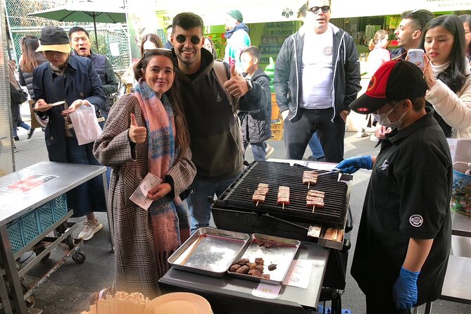 From Ocean to Chopsticks Tsukiji Market Food Tour By Local Expert - Walking through Tsukiji Jogai Market