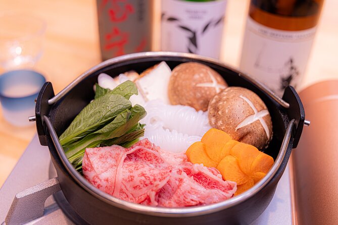 Japanese Sake Tasting & Wagyu Sukiyaki Cooking Class in Tokyo - A vegetable-carving demonstration while lunch cooks