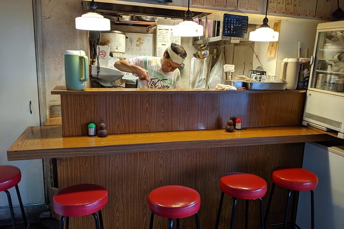 Private Tokyo Food Tour - A Journey Through Time Through Food - Ginza and Yurakucho explain food under the railway tracks