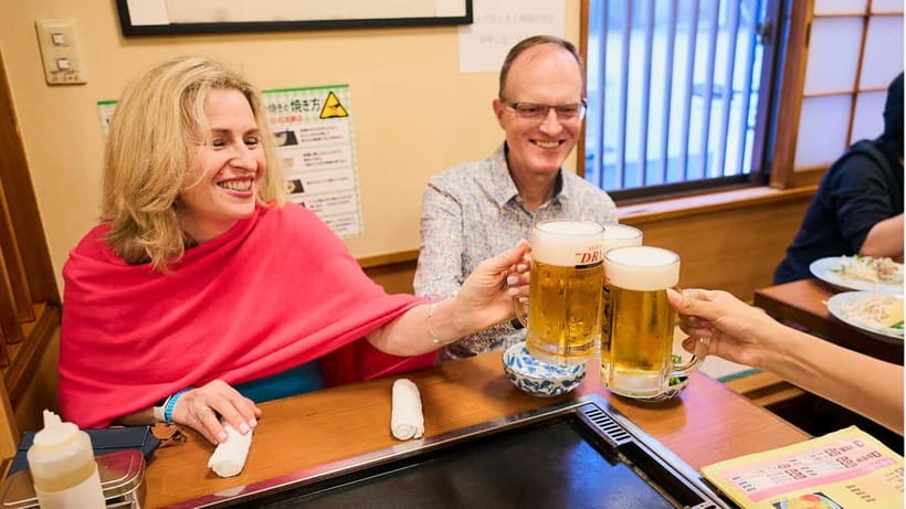 Tokyo: Asakusa Guided Food Tour with 12 Dishes & 3 Drinks - An izakaya meal with three included drinks