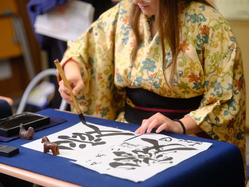 Tokyo: Calligraphy Experience with yukata or Samue - From practice sheets to your final artwork