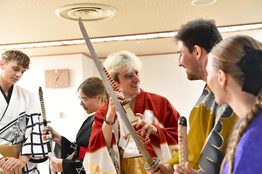Tokyo: Taishu Engeki Show with Kimono and Sword Lesson - Putting on a kimono in a tatami room