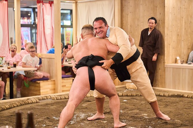 TokyoSumoShow, ChickenHotPot, and Mochi-Pounding by Pro Wrestlers - The ring entrance brings sumo close